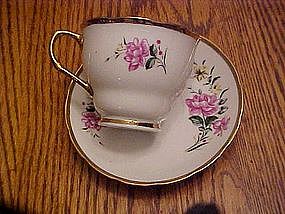 Rose pattern tea cup with matching saucer