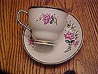 Rose pattern tea cup with matching saucer