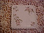 Antique porcelain trivet with florals