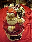 Santa Claus with bag of toys, cookie jar
