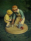 Avon "Helping Mom" figurine,  by Jessie Wilcox Smith