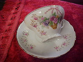 Vintage tea cup and saucer with flower basket pattern