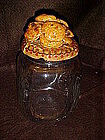 Clear glass cookie jar with real cookies on top