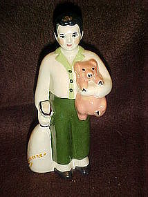 Ceramics arts studios, boy and pig figurine