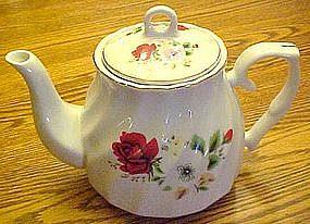 China teapot with red roses and florals