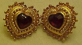 Goldtone heart earrings with ruby red rhinestone center