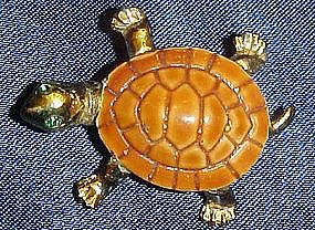 Adorable gold tone turtle pin with rhinestone eyes