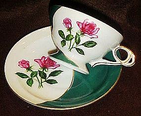 Fancy china teacup and saucer set,   green with roses