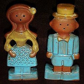 Vintage clay man and woman salt and pepper shakers.