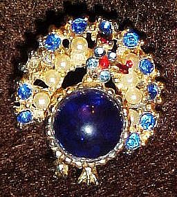 Vintage jelly belly  peacock pin, sapphire blue stones