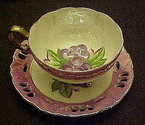 Vintage Enesco lustre, three legs cup and saucer set