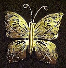 Goldtone butterfly pin with delicate filigree