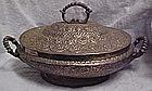 Old hand tooled  metal covered casserole dish