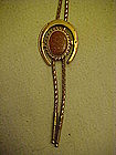 Gold stone lucky horseshoe bolo tie