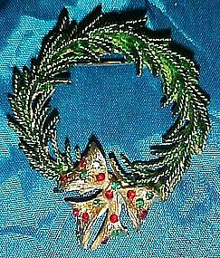 Evergreen wreath pin with rhinestone bow