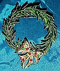 Evergreen wreath pin with rhinestone bow