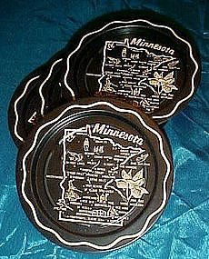 Set of four Minnesota souvenir coasters, black metal