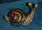 Adorable snail pin with rhinestone accents