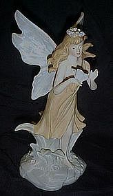 Large porcelain fairy with butterfly figurine