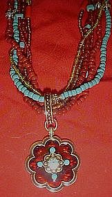 Avon six strand beaded necklace with medallion