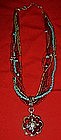 Avon six strand beaded necklace with medallion