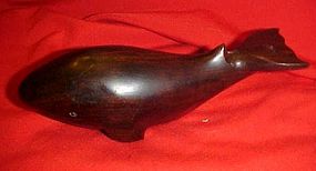 Hand carved dark wood whale figure