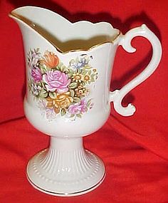 Footed  porcelain pitcher / vase with roses