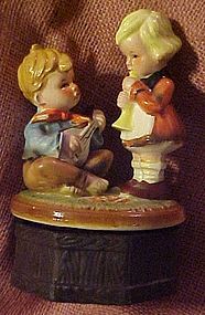 Older Hummel style  ceramic music box, boy and girl