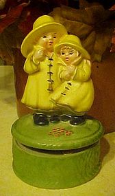 Vintage musical figurine, Children in rain coats