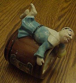 Kreiss Elegant Heirs ashtray, Man in dress on barrel