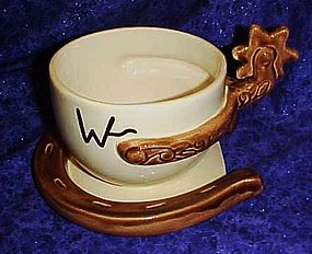 Oversized Western cup and saucer, horseshoe and spur