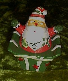 Santa jumping out of present salt and pepper shakers