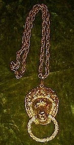 Great chunky gold tone Lion doorknocker pendant