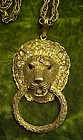 Great chunky gold tone Lion doorknocker pendant