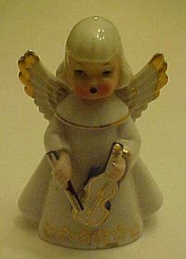 vintage angel figurine playing violin