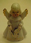 vintage angel figurine playing violin