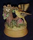 Musical porcelain bird figurine