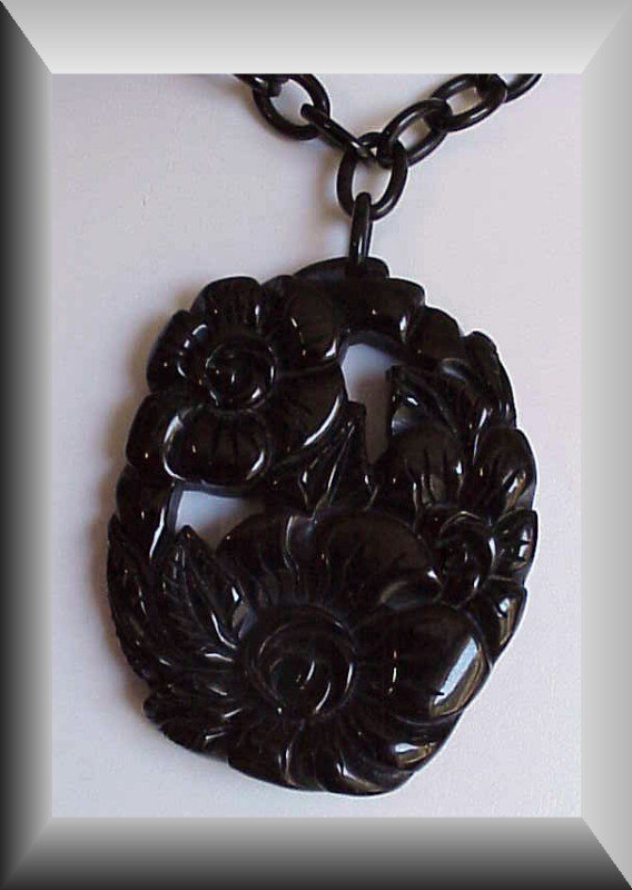 Bakelite carved floral pendant &amp; chain - Vintage