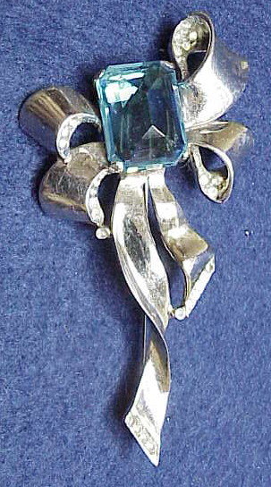 Reja  sterling bow  brooch-topaz colored  center stone