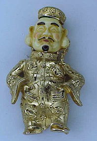 Napier "Ming"  man holding his belly brooch