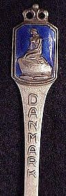 Sterling souvenir spoon: Danmak nude on rock-Enamel