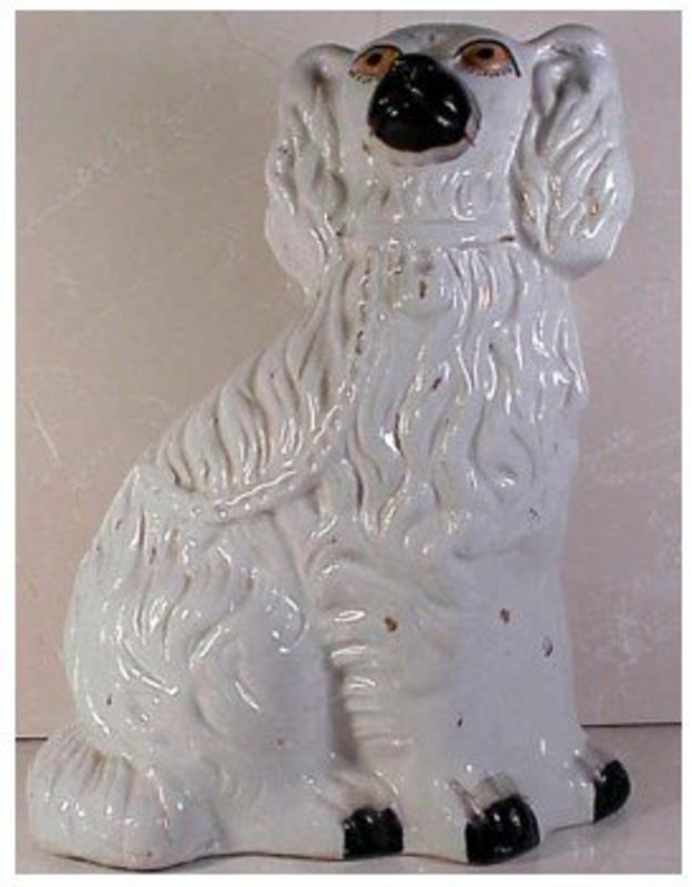 Staffordshire  white and gilt seated spaniel