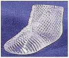 Circa 1900 ribbed glass bootee with a diamond pattern