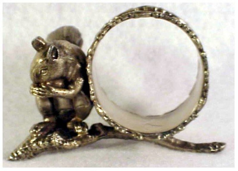 Victorian squirrel sitting on branch napkin ring eating