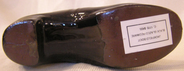 Jackfield Boot of Black glazed Redware