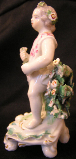 Derby Porcelain Figure of Putto with Pink Flowers