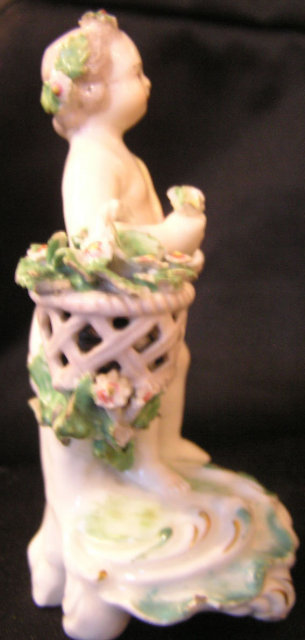 Derby Porcelain Figure of Putto with Pink Flowers