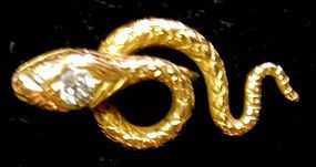Stickpin of 14K yellow gold snake with diamond in head