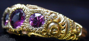Ring of 3 stone amethyst set in chased 14K