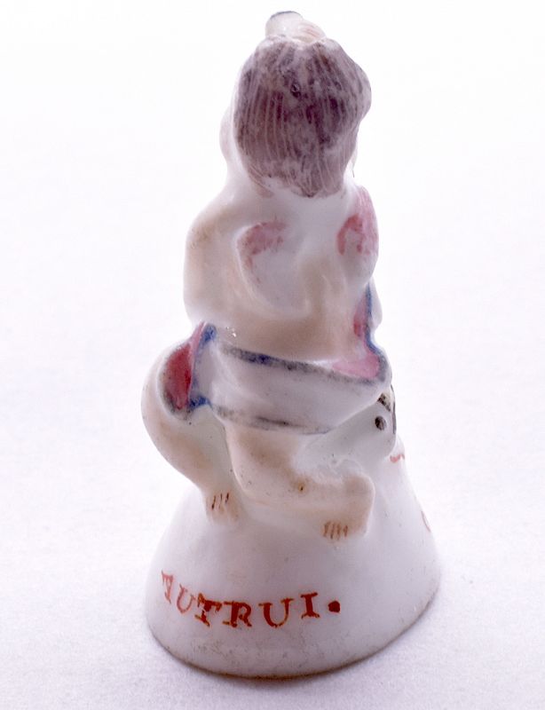 C1745, Chelsea Porcelain Seal Seated Cupid with Spy-Glass